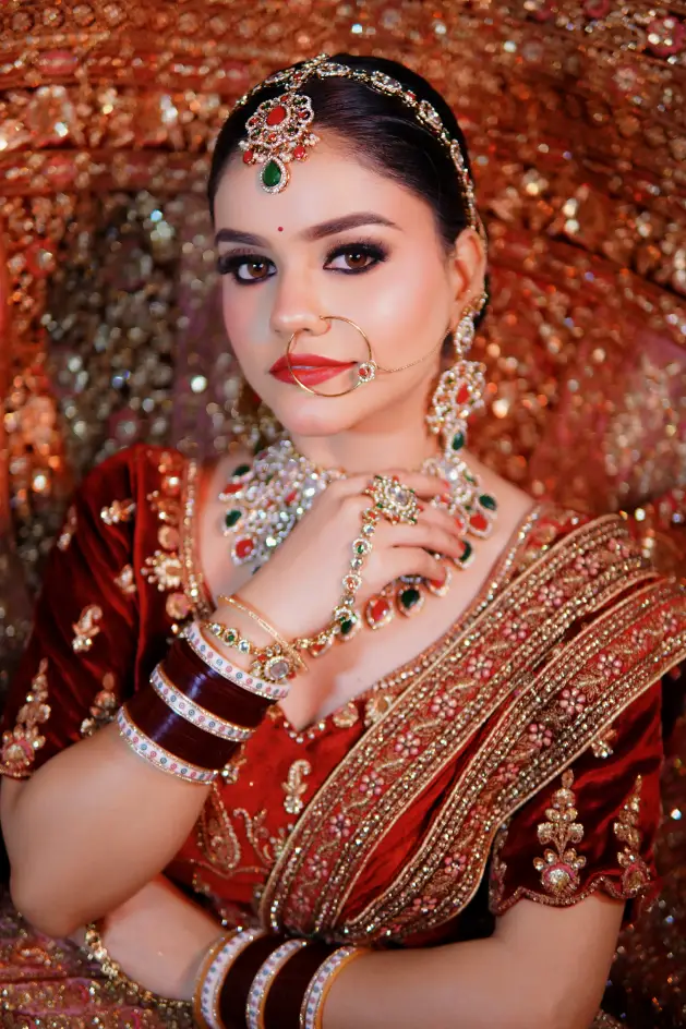 Bridal makeup with traditional red attire and jewelry