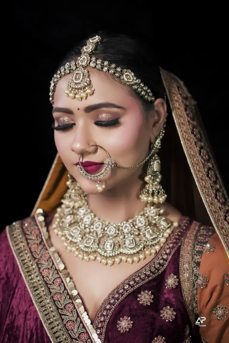 Bridal makeup with traditional red attire and jewelry