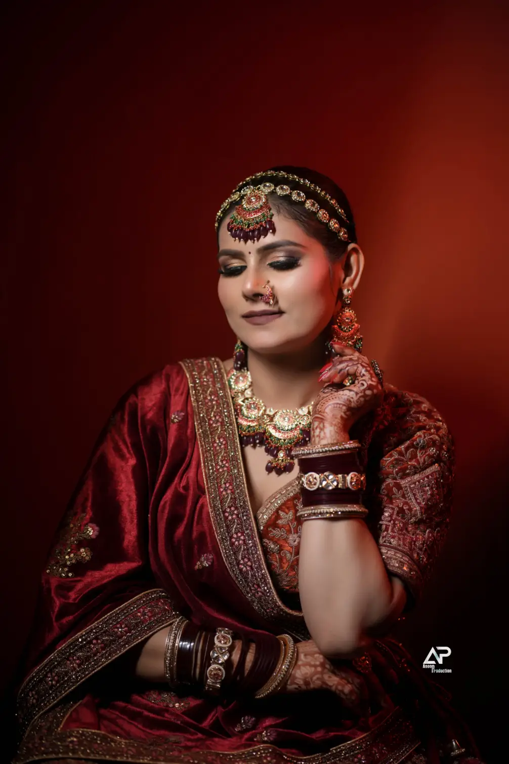 Bridal makeup with traditional red attire and jewelry