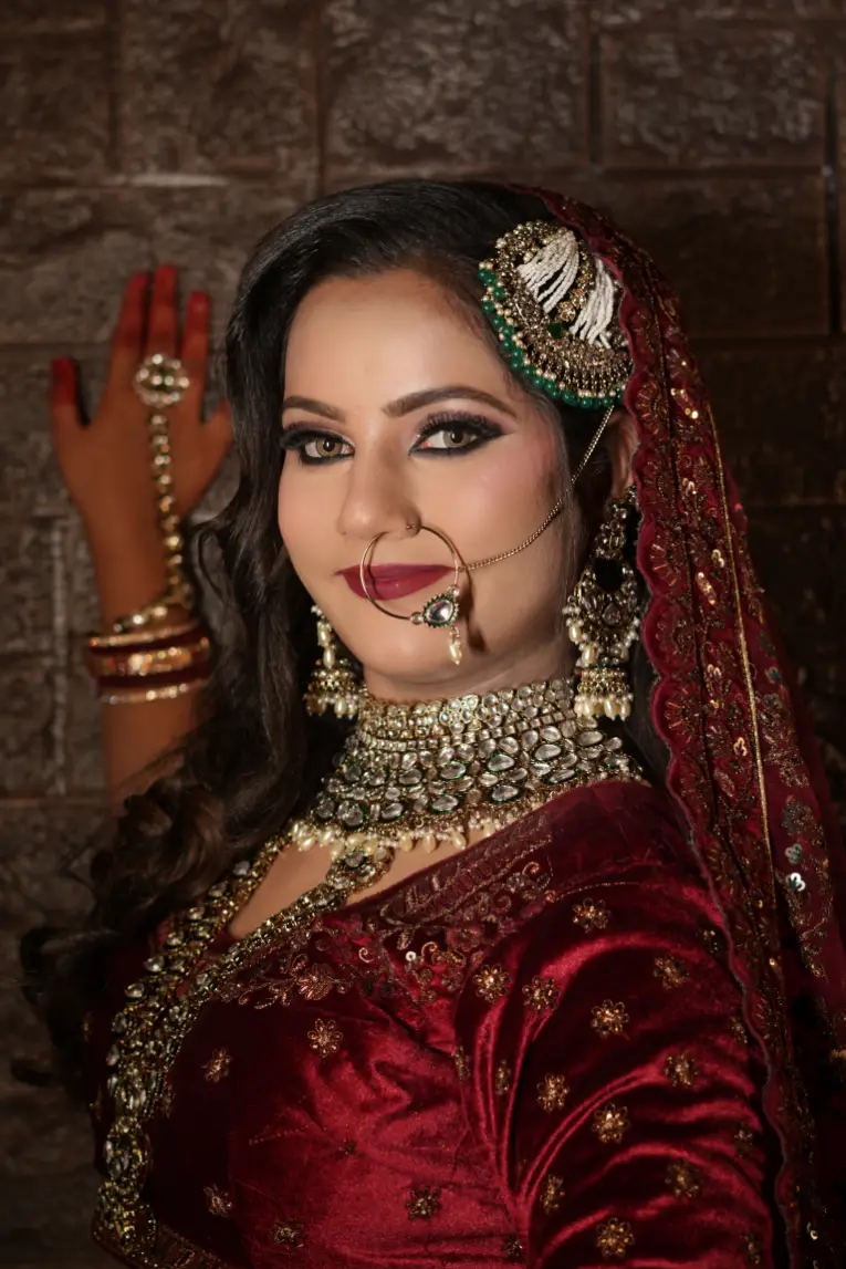 Bridal makeup with traditional red attire and jewelry